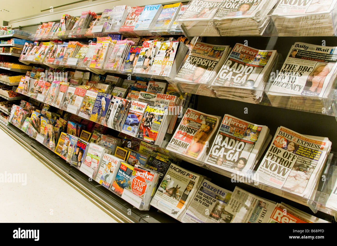 Newspapers and Magazines for sale in a supermarket in Britain Stock Photo