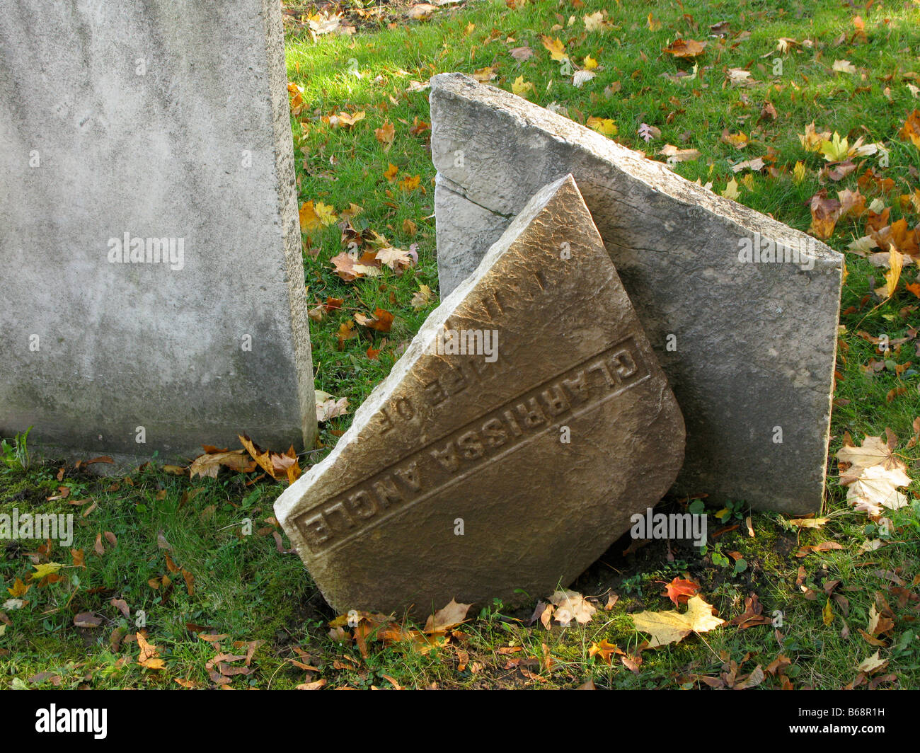 Broken grave stone at Mount Hope Cemetery in Rochester, NY USA. Stock Photo