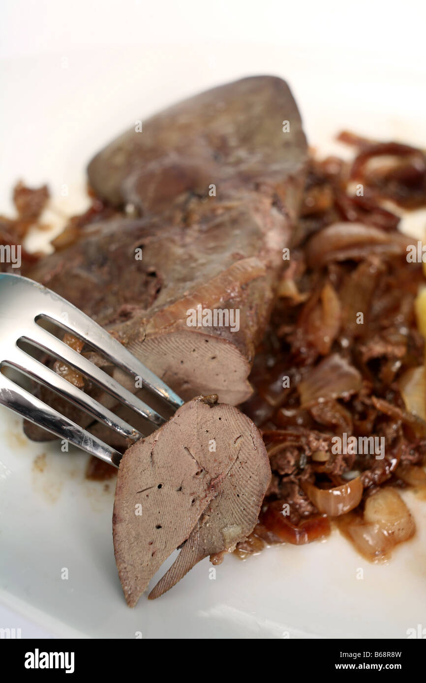 A meal of lamb s liver with caramelised onions The piece on the fork