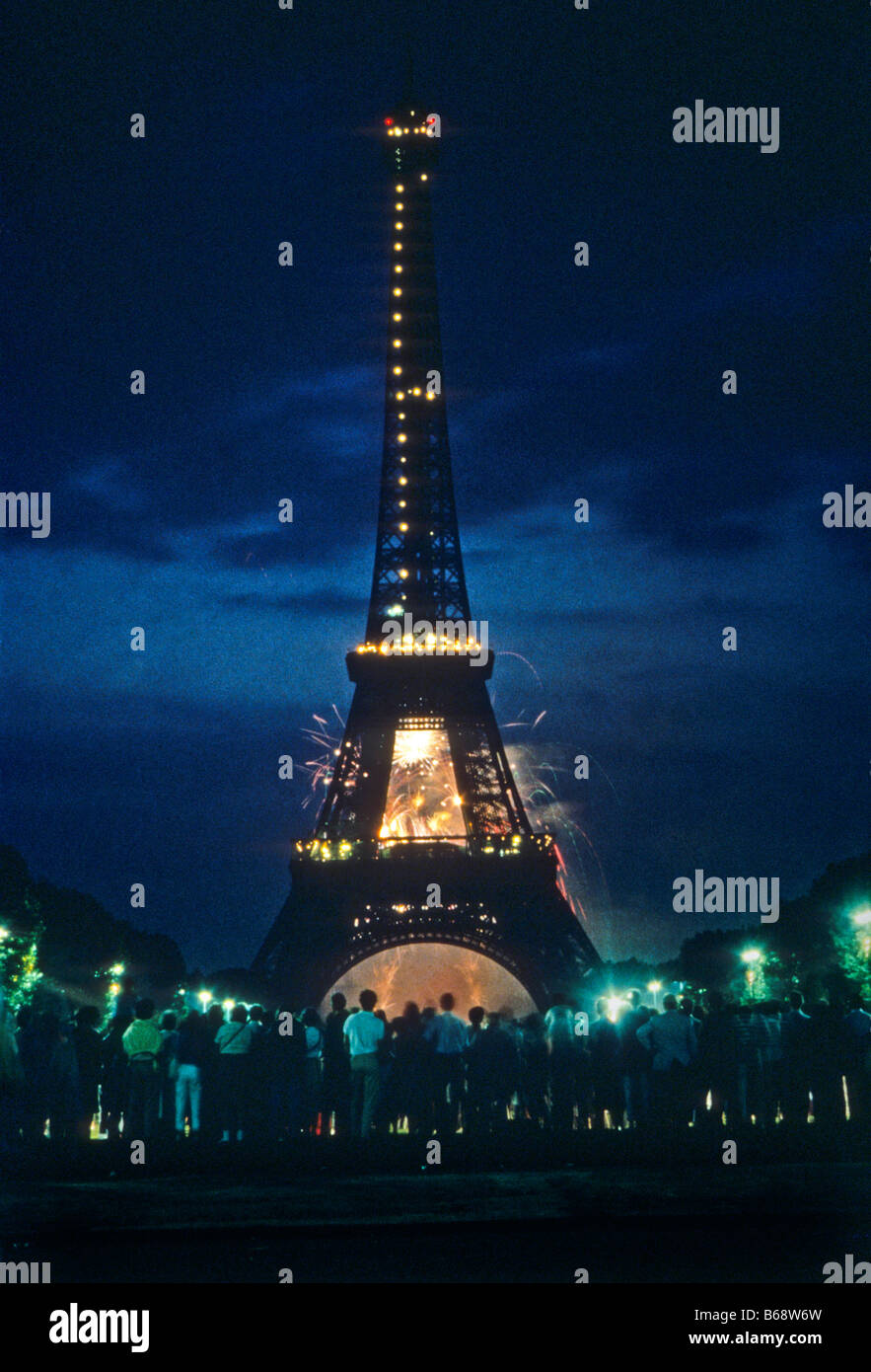 Night view of Eiffel Tower in Paris with fireworks of Bastille Day in sky. Stock Photo
