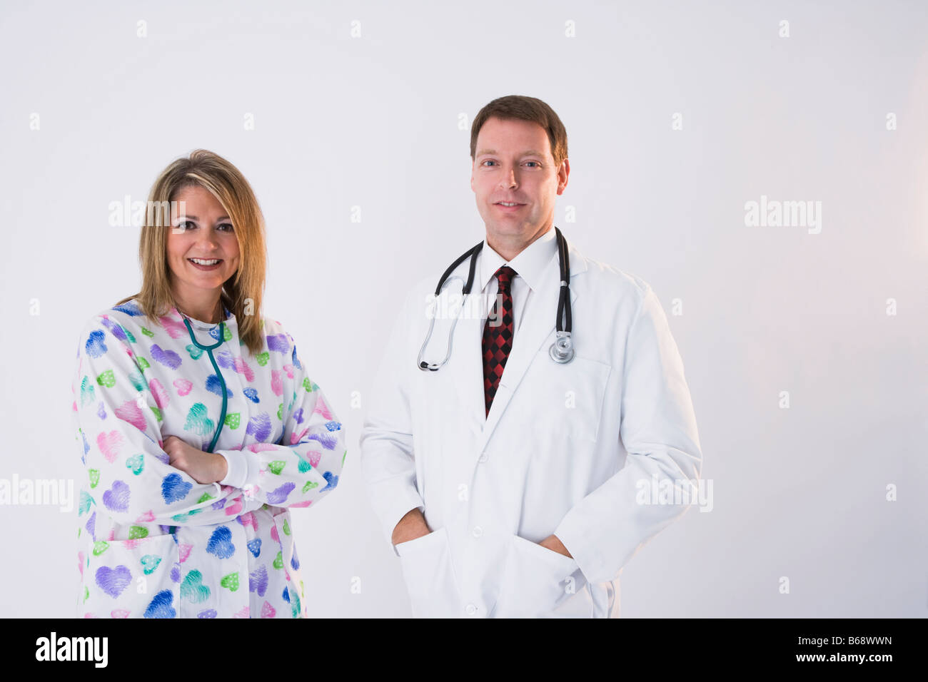 Male doctor and female nurse with stethoscopes, portrait Stock Photo