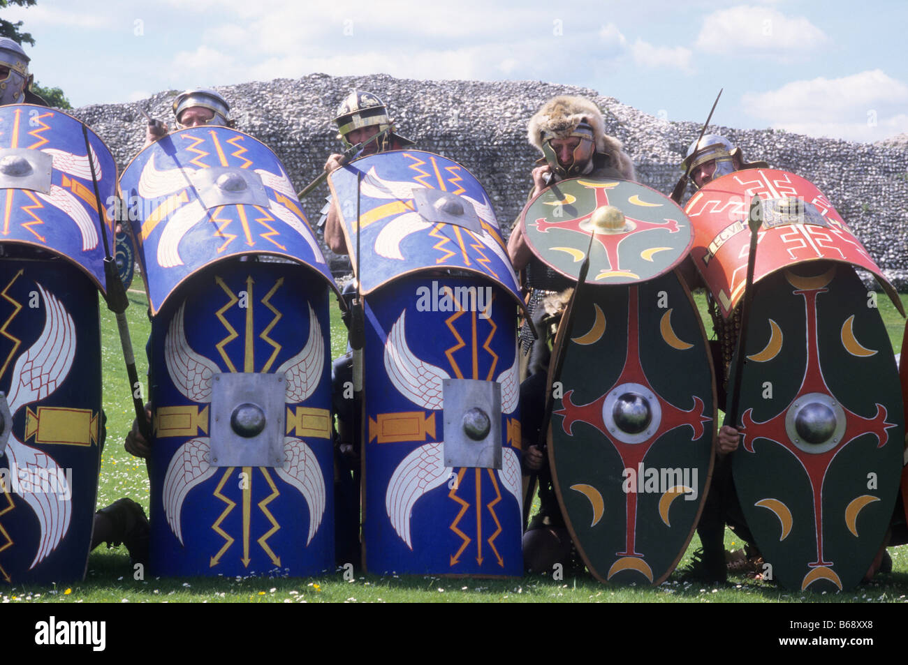 Roman Shield Wall historical re-enactment tortoise shields protection soldiers soldier armour England UK Stock Photo