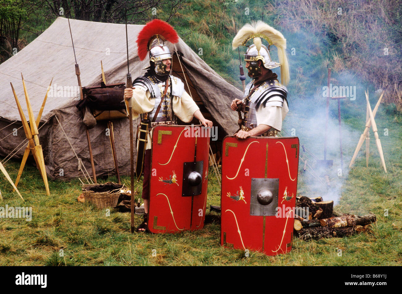 Roman soldier soldiers Centurion historical re-enactment encampment Legio II Augusta shields javelin weapons weaponry tent Stock Photo