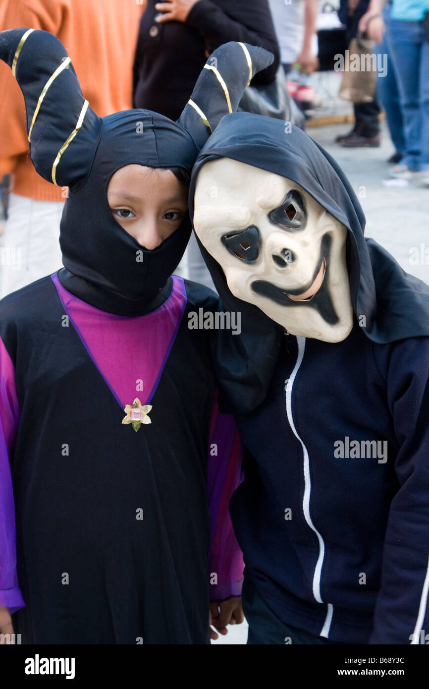 Oaxaca, Mexico. Day of the Dead.  Celebrations Two Children in Costume in Zocalo, the Town Square. Stock Photo