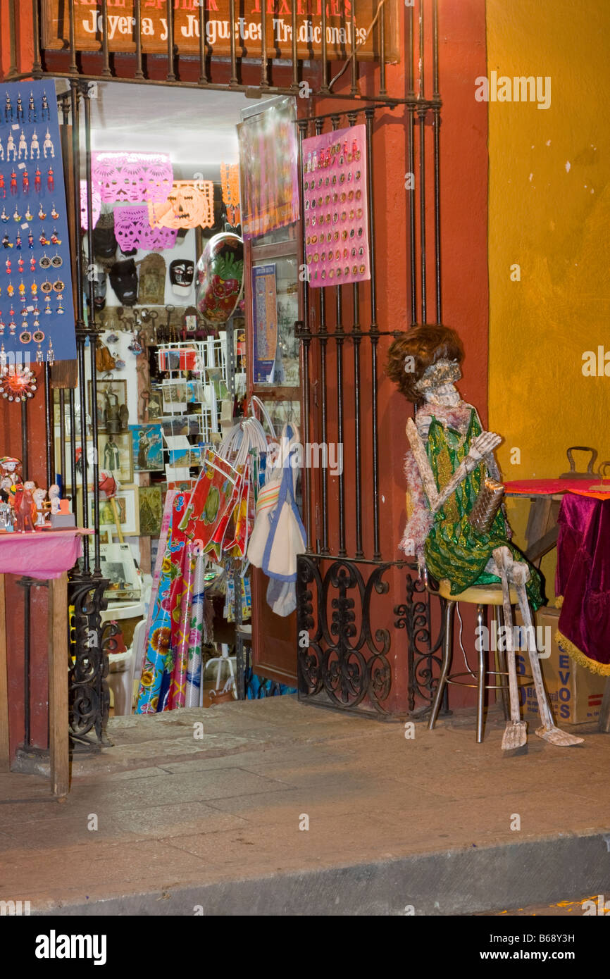 Oaxaca, Mexico. Day of the Dead.  Skeleton Mannequin Invites Customers into Shop Selling Souvenirs, Toys, and Jewelry. Stock Photo