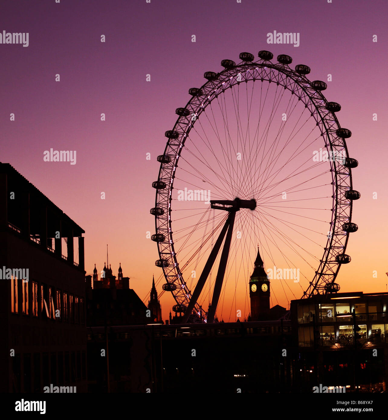 London landscape at sunset with London eye and Big Ben in the background. Stock Photo