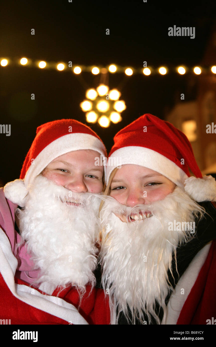 Christmas fair two happy swedish traditional santa claus två jultomtar på svensk julmarknad i Ängelholm Skåne Sverige Sweden Stock Photo