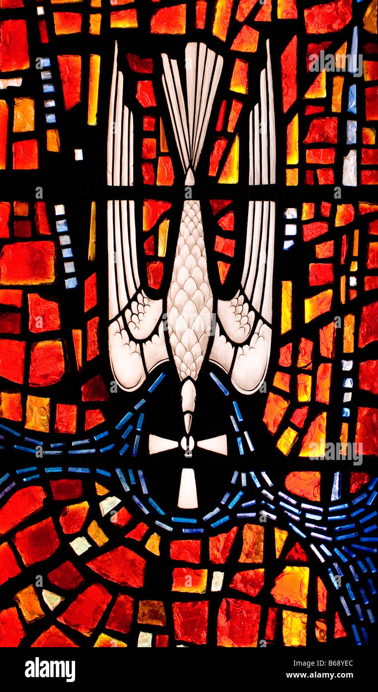 Stained glass mosaic window in a church with a dove and cross Stock ...