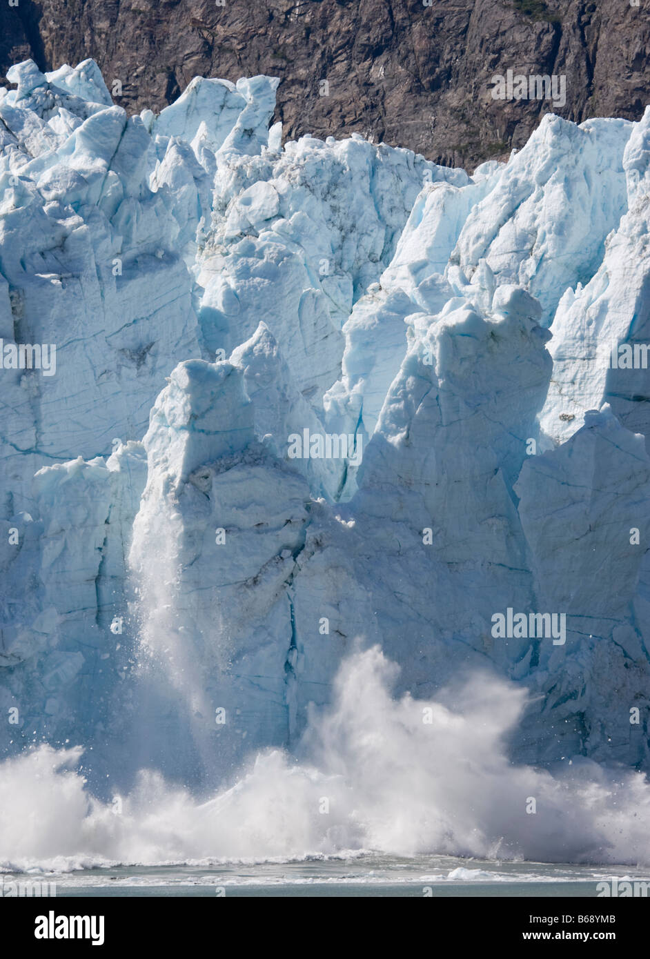 USA Alaska Glacier Bay National Park Icebergs calve with explosive splash from Margerie Glacier in Tarr Inlet on summer morning Stock Photo