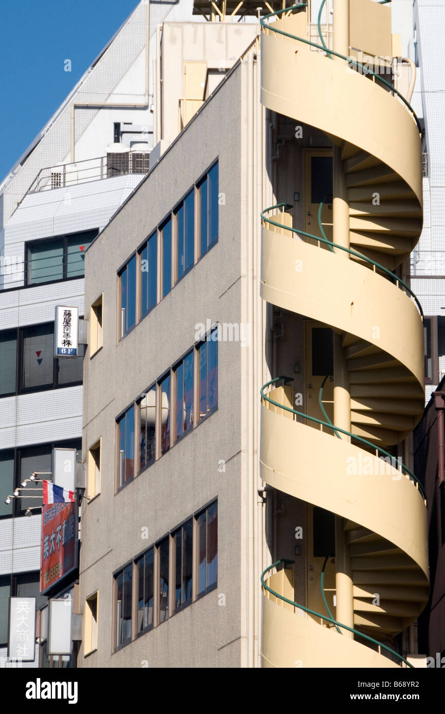 Spiral staircase outside a building on Shinjuku Dori  Tokyo Japan Stock Photo