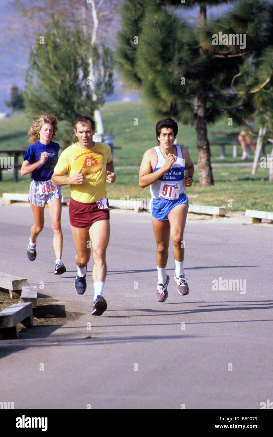 Runners compete in long distance race. Stock Photo