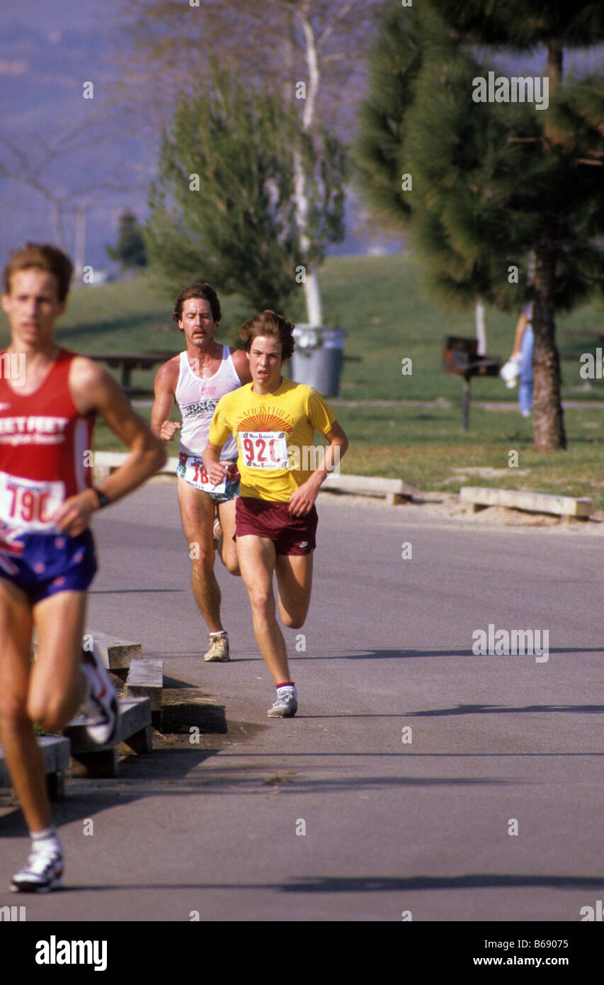 Runners compete in long distance race. Stock Photo
