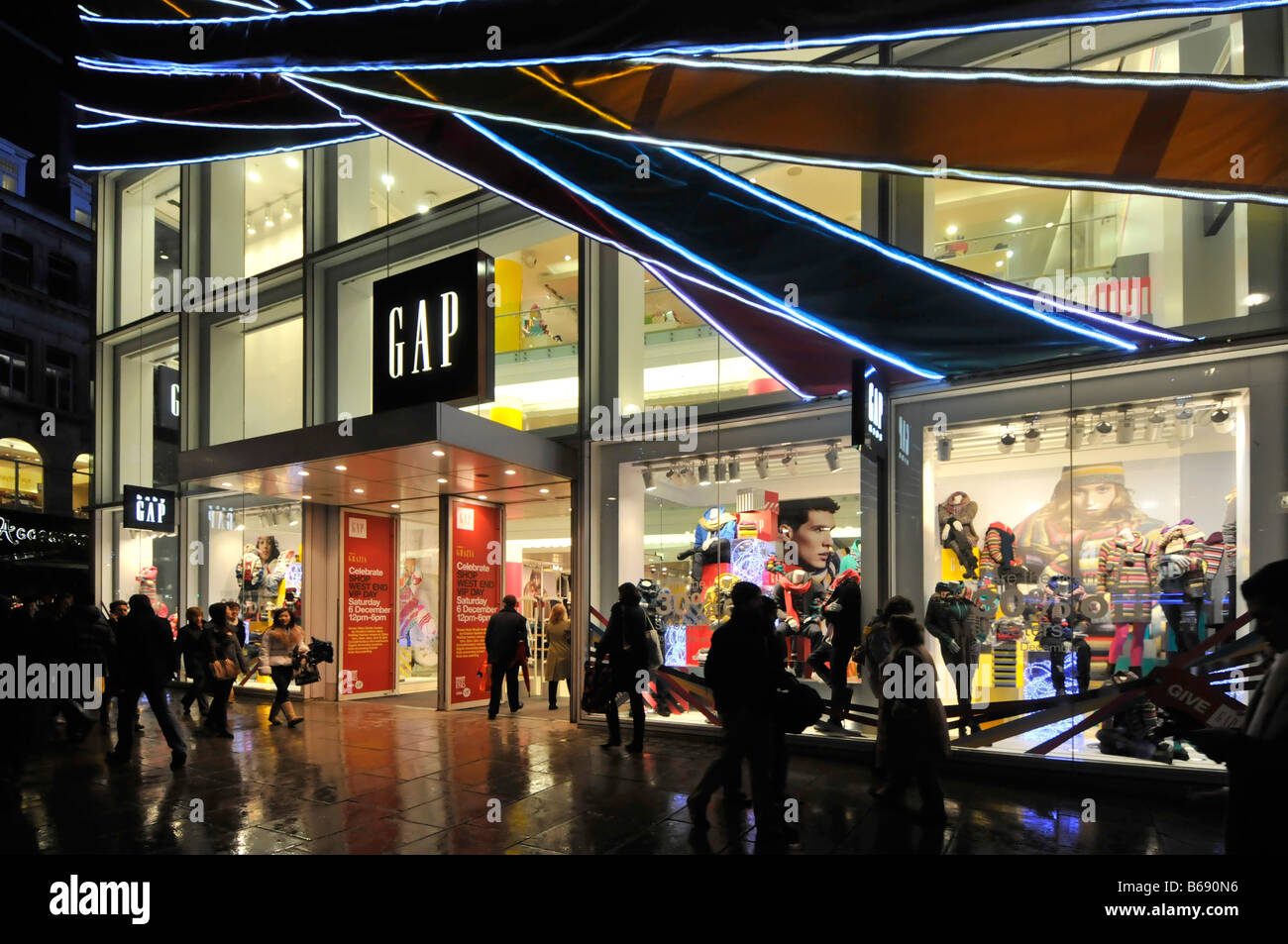 Shoppers outside the Gap fashions store Oxford Street London Stock ...