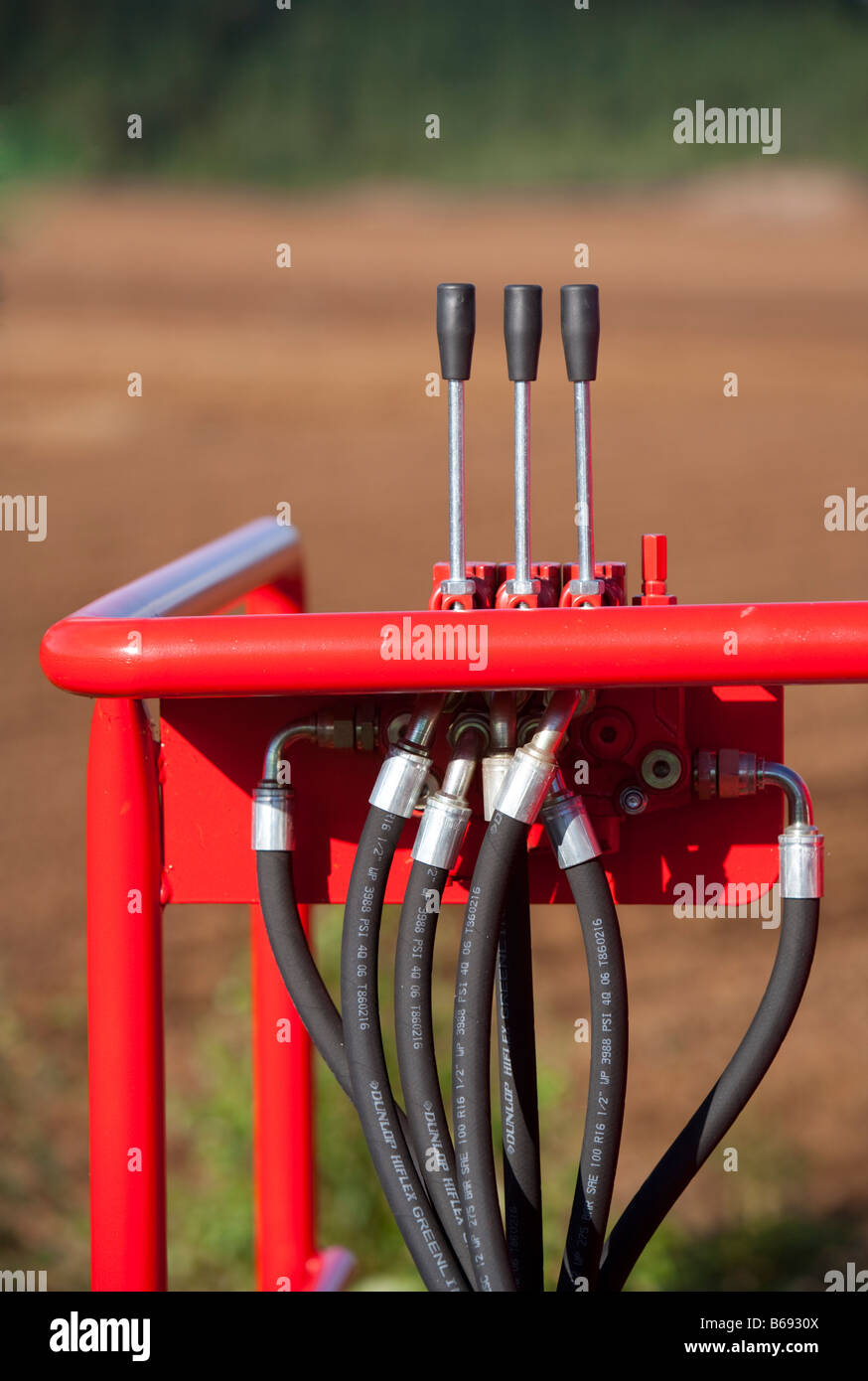 Hydraulics pipes and control system with metal levers Stock Photo Alamy