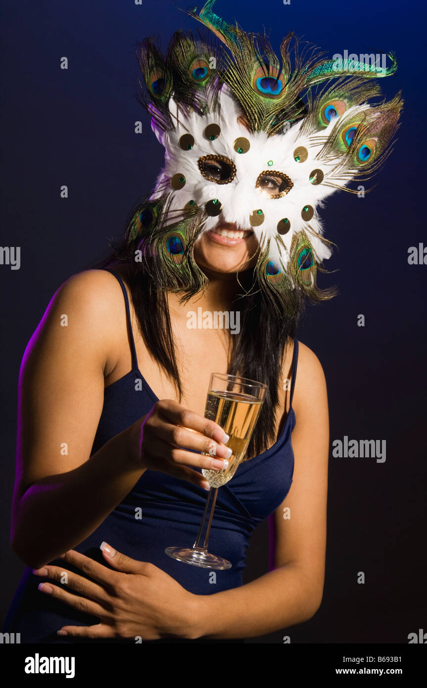 Studio portrait of young woman wearing mask Stock Photo