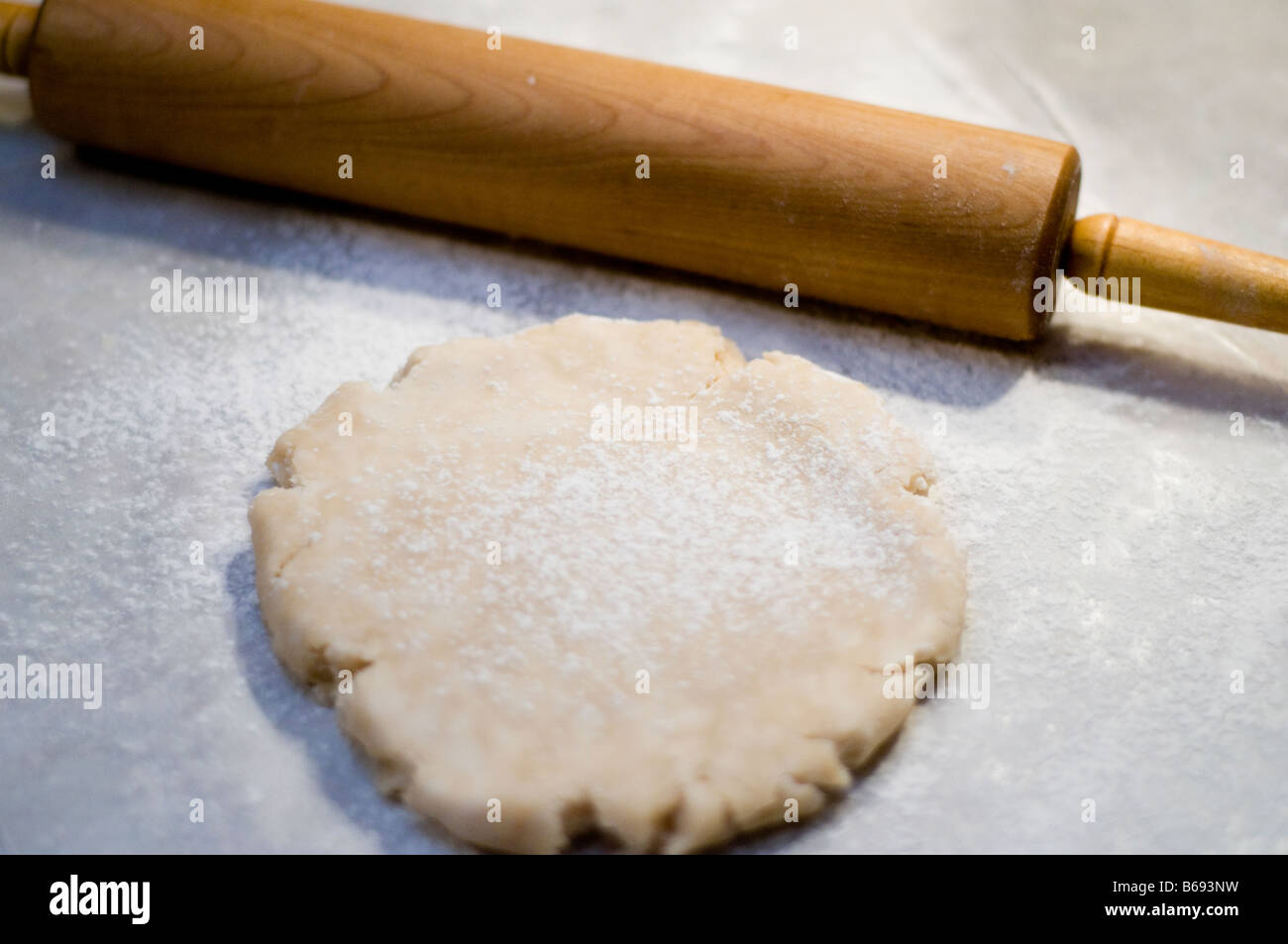 Rolling out pie shell with wooden rolling pin. USA Stock Photo Alamy
