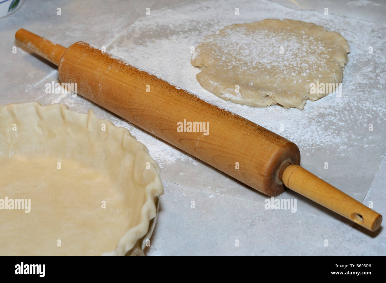 Rolling out pie shell with wooden rolling pin. USA Stock Photo Alamy