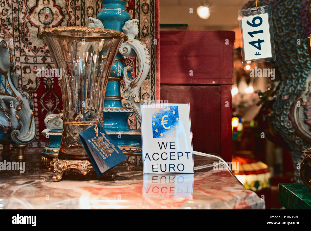 We Accept Euro sign in store window display Midtown Manhattan New York