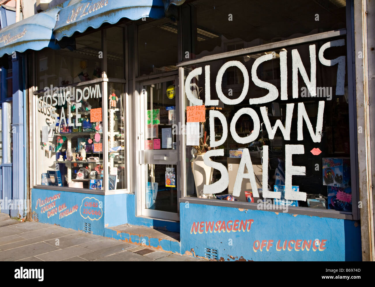 Shop with closing down sale sign in window Merthyr Tydfil Wales UK Stock Photo