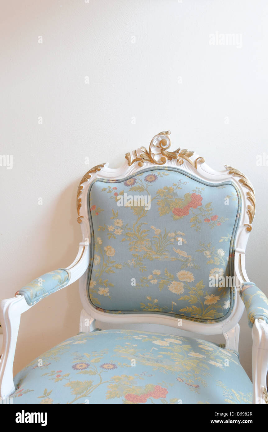Blue upholstered chair Stock Photo Alamy