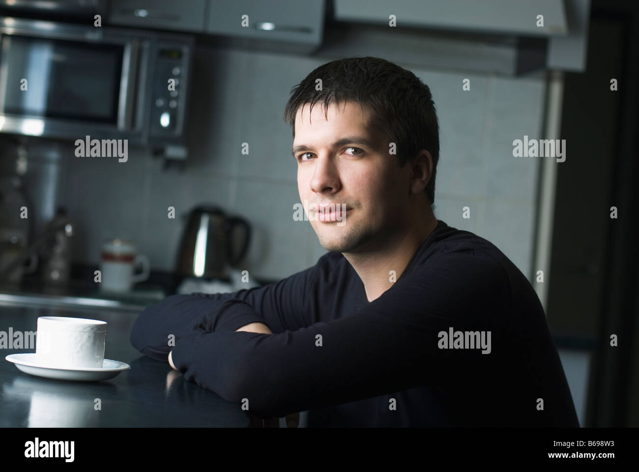 Man sitting at counter hi-res stock photography and images - Alamy