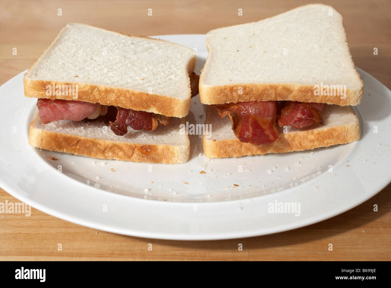 Bacon butty in white bread Stock Photo