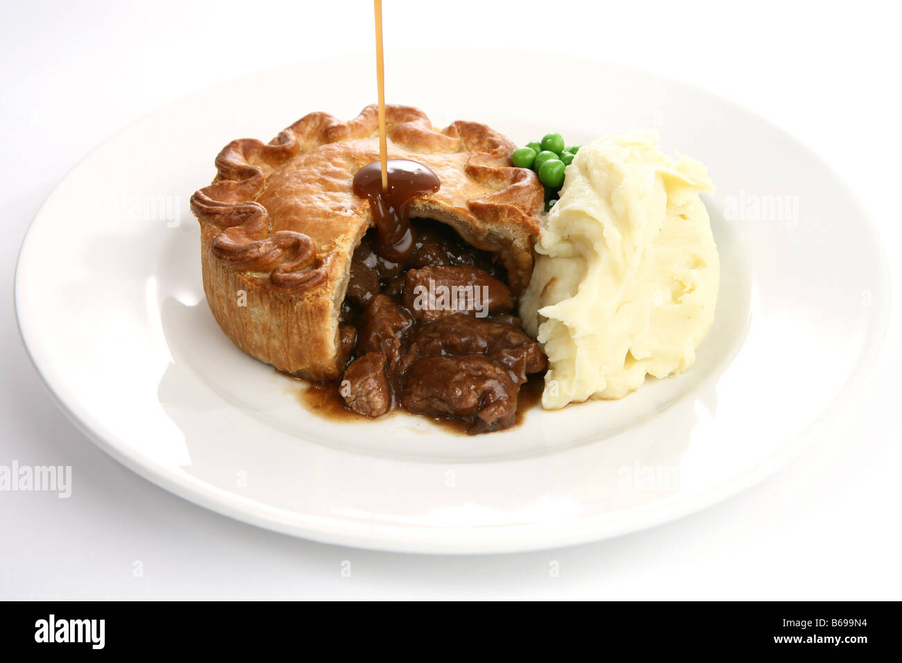 Steak pie with gravy Stock Photo Alamy