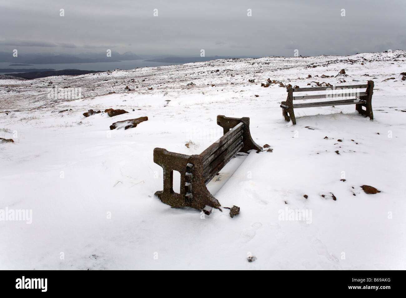 Snow covered, abandoned seating at the Bealach na Ba viewpoint Height above sea level 2053 ft Applecross Peninsula in Wester Ross, Ross and Cromarty Stock Photo