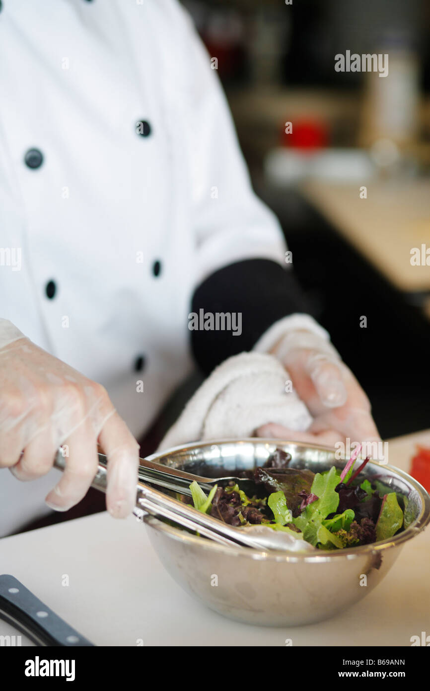 Chef mixing green salad Stock Photo Alamy