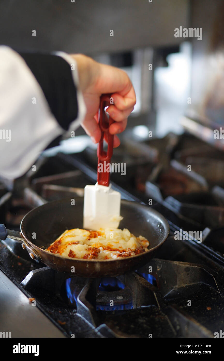Chef preparing potato pancake at the restaurant kitchen Stock Photo Alamy
