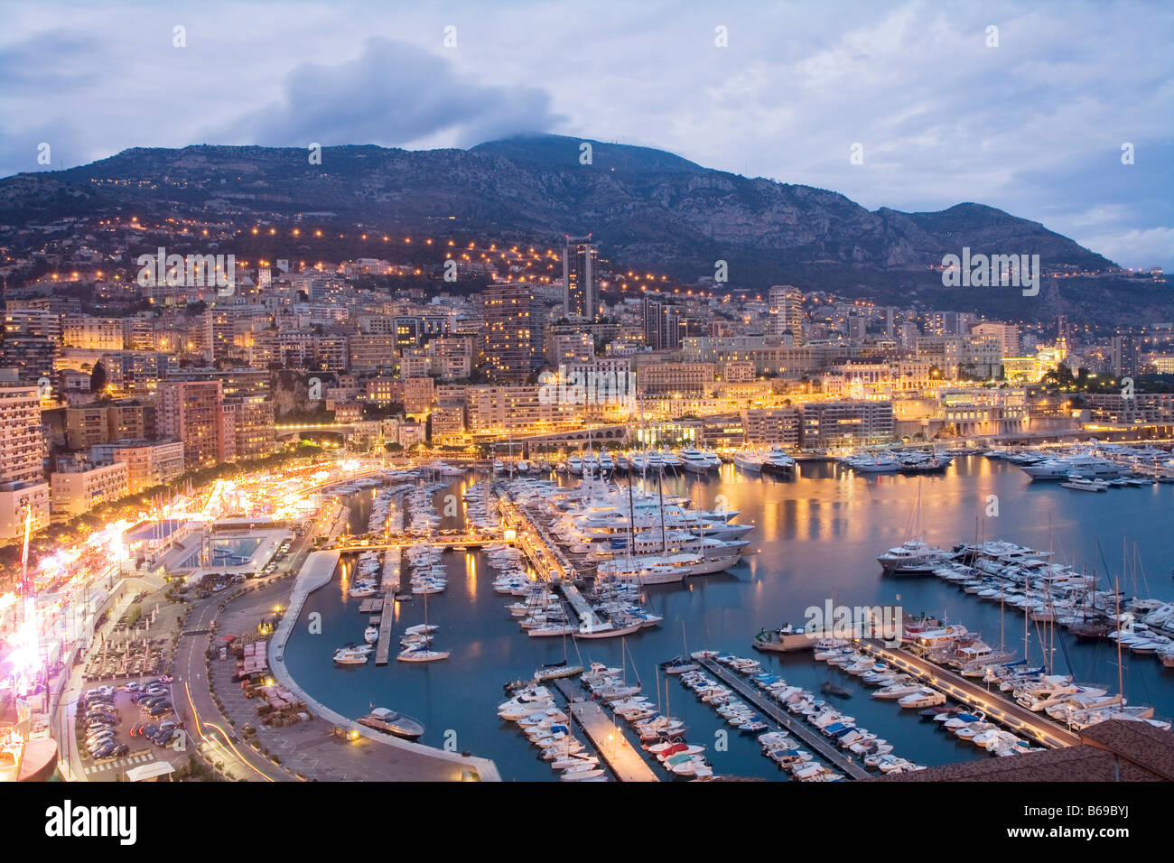 Overview Monaco, Monte Carlo, harbour with luxury boats and ships at dusk, France, Europe, EU Stock Photo