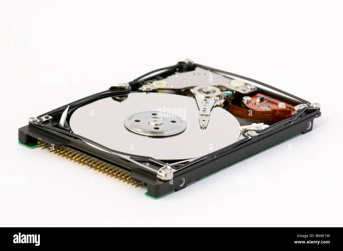 Opened hard disk showing the disk surface and drive head Stock Photo