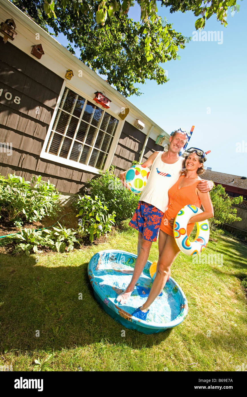 Couple wearing snorkels and standing in a wading pool Stock Photo Alamy