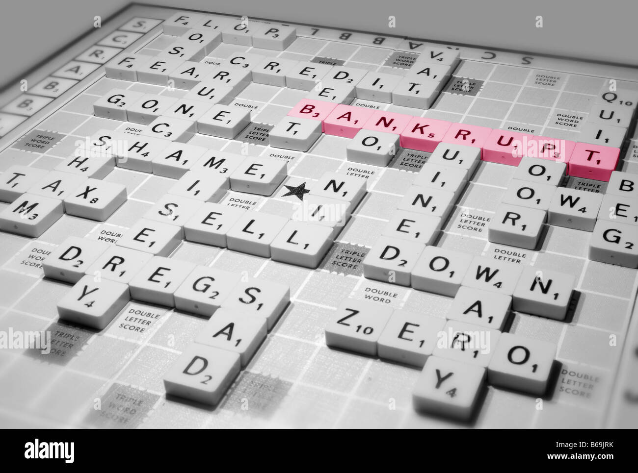 A scrabble game highlights global recession issues of the credit crunch and other financial implications Stock Photo