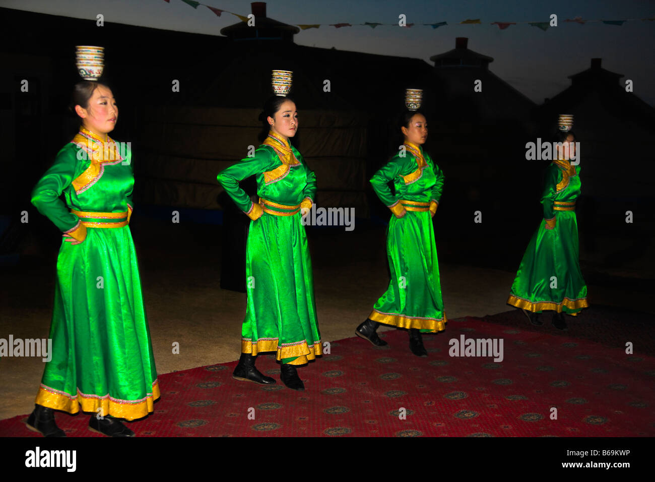 Four young women dancing, Inner Mongolia, China Stock Photo