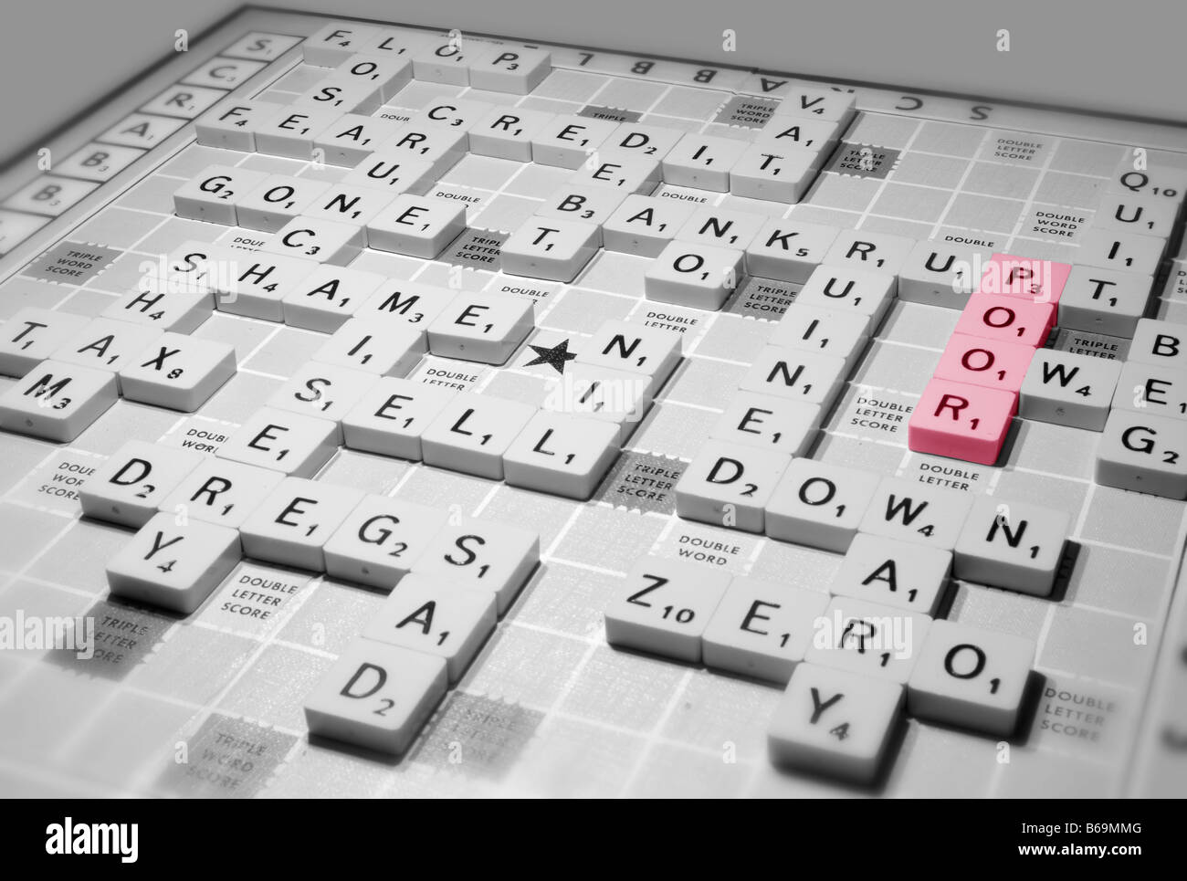 A scrabble game highlights global recession issues of the credit crunch and other financial implications Stock Photo