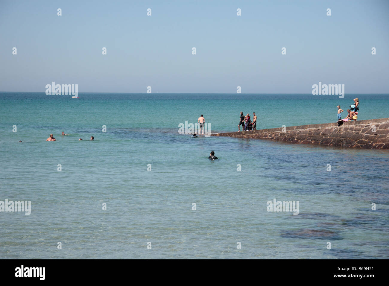 dh Les Jardins de la Mer ST HELIER JERSEY Women swimming with dolphins  fountain statue sculpture water feature channel islands uk Stock Photo -  Alamy