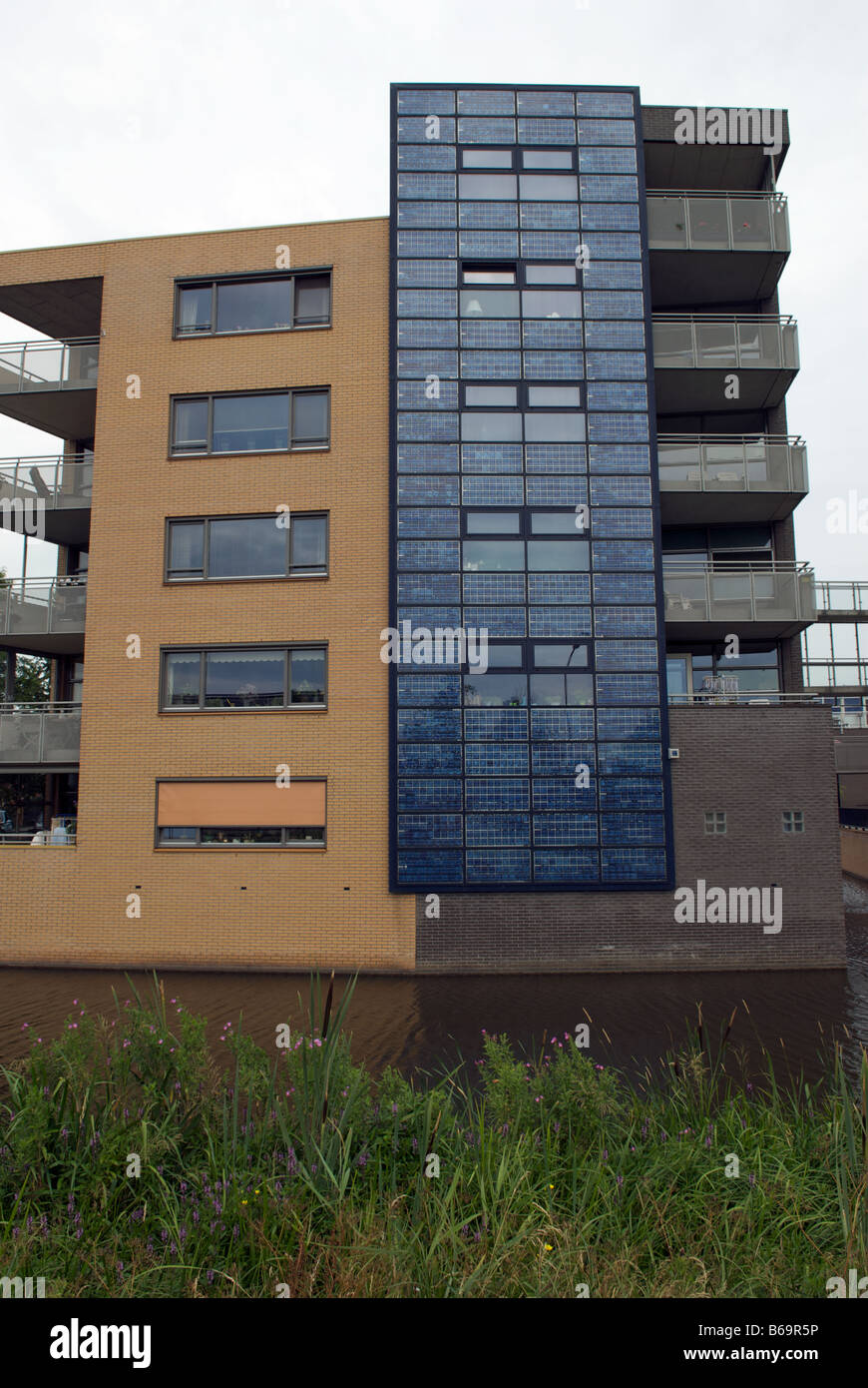 Shell solar panels fitted to apartments on the world's largest solar powered housing estate, Nieuwland, Amersfoort, Netherlands. Stock Photo