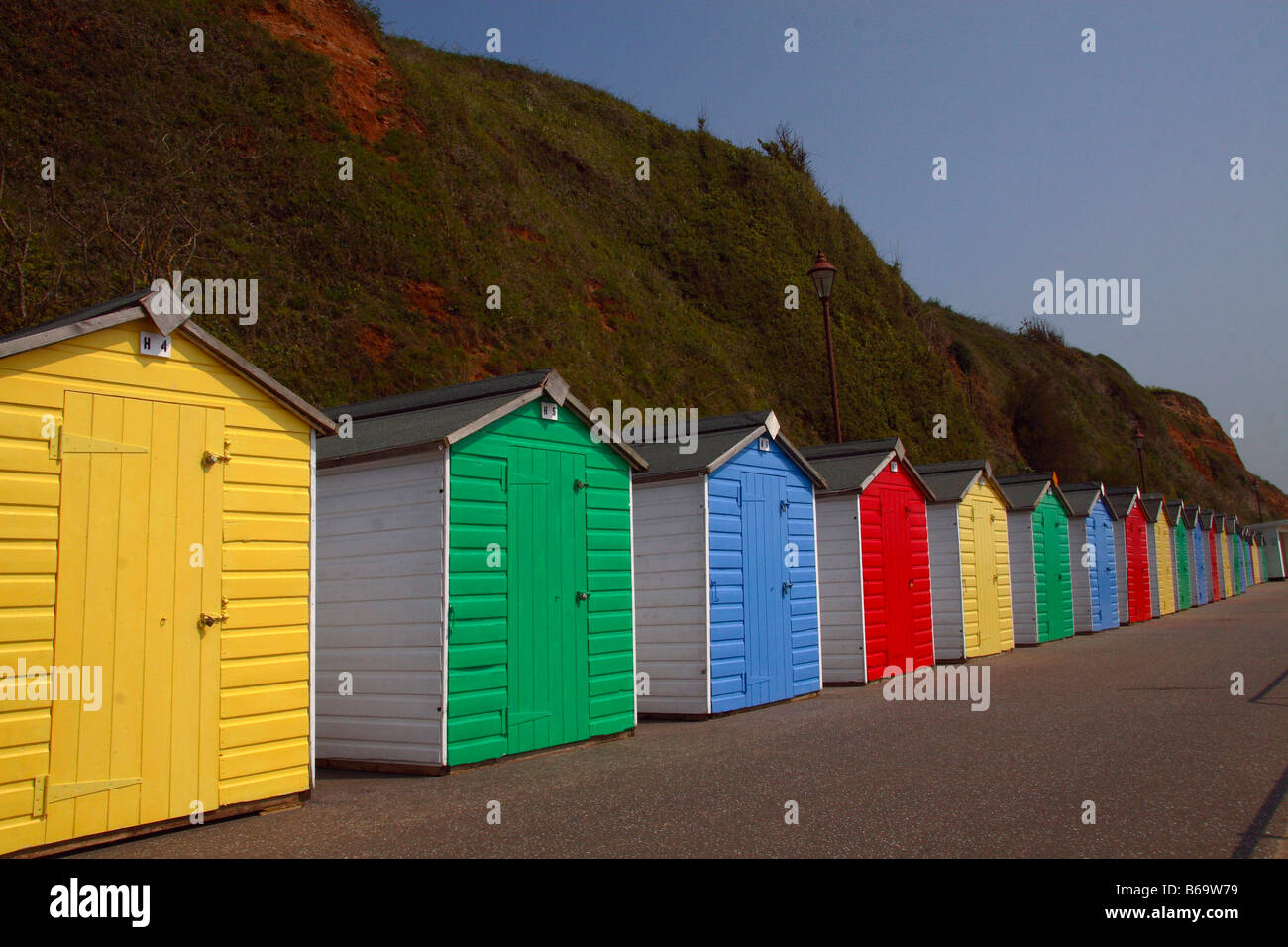 beach-huts-seaton-devon-colourful-row-seaside-sheds-paint