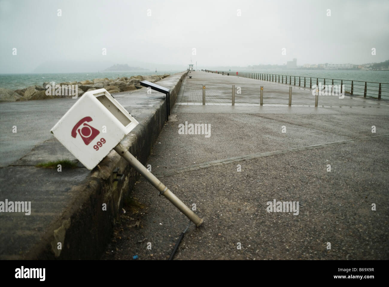 Damaged 999 telephone stand at Plymouth sea front Devon UK Stock Photo
