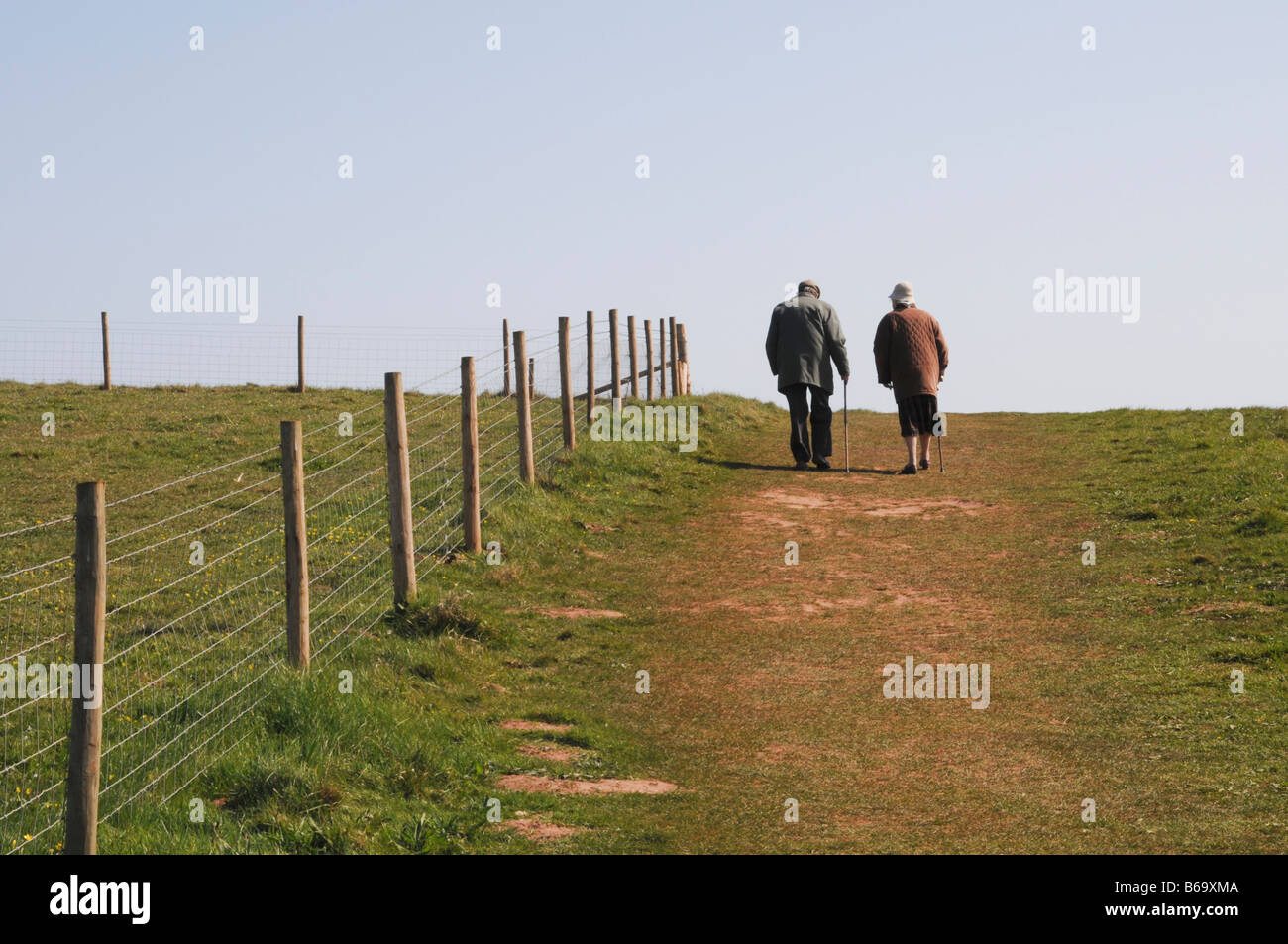 Two elderly people taking a Sunday Stroll Stock Photo