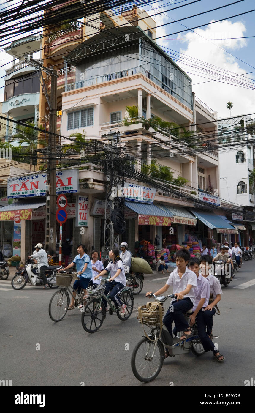 School children on bikes in Ho Chi Minh City, Vietnam Stock Photo