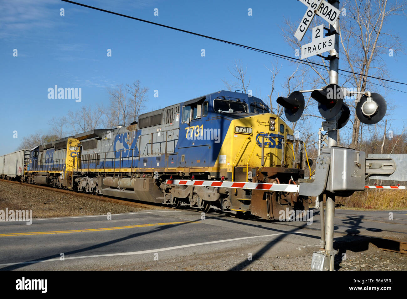 Freight train passing railroad crossing in Fairport NY, USA Stock Photo