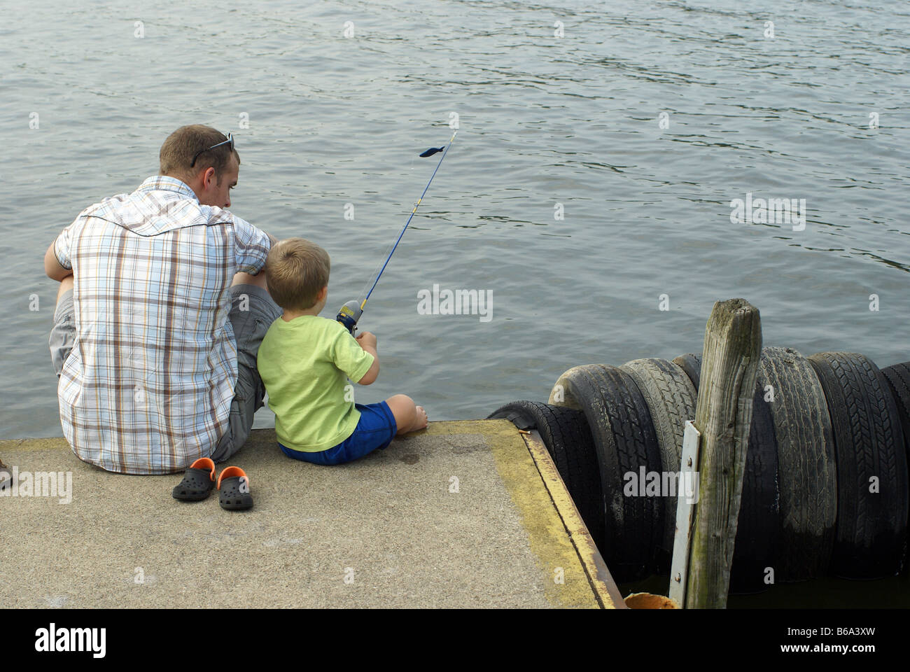 Teach son to fish hi-res stock photography and images - Alamy