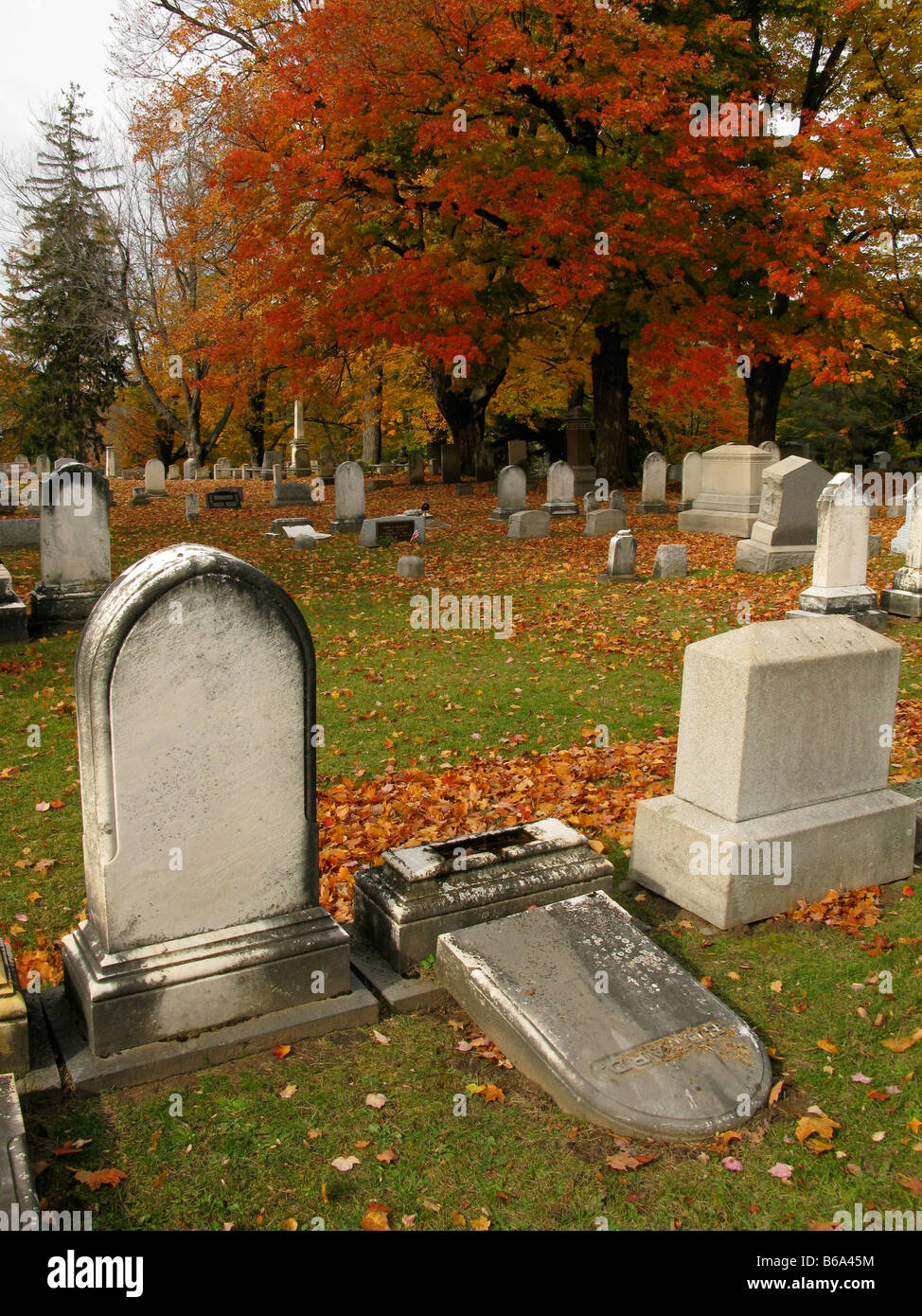 Fallen grave stone at Mount Hope Cemetery in Rochester, NY USA. Stock Photo