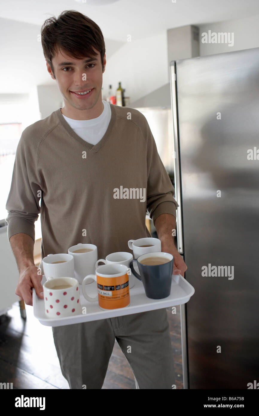 Man carrying tray of drinks Stock Photo Alamy