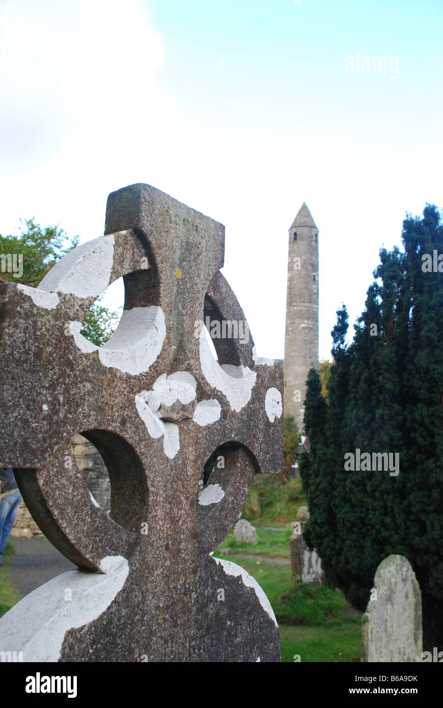 Celtic cross in Glendalough (valley of the two lakes)-- an early ecclesiastical settlement founded by St. Kevin in Ireland. Stock Photo