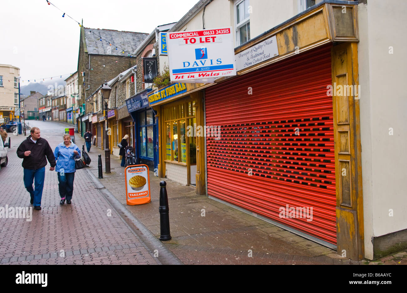Closed and shuttered former butchers shop TO LET in Abertillery South
