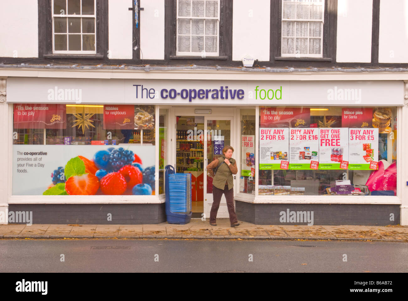 The Co-operative co-op food shop store with customer coming out in Harleston,Norfolk,Uk Stock Photo