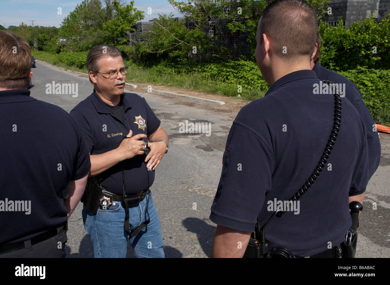 Bladensburg Police officers  talk among themselves in Bladensburg, Maryland Stock Photo